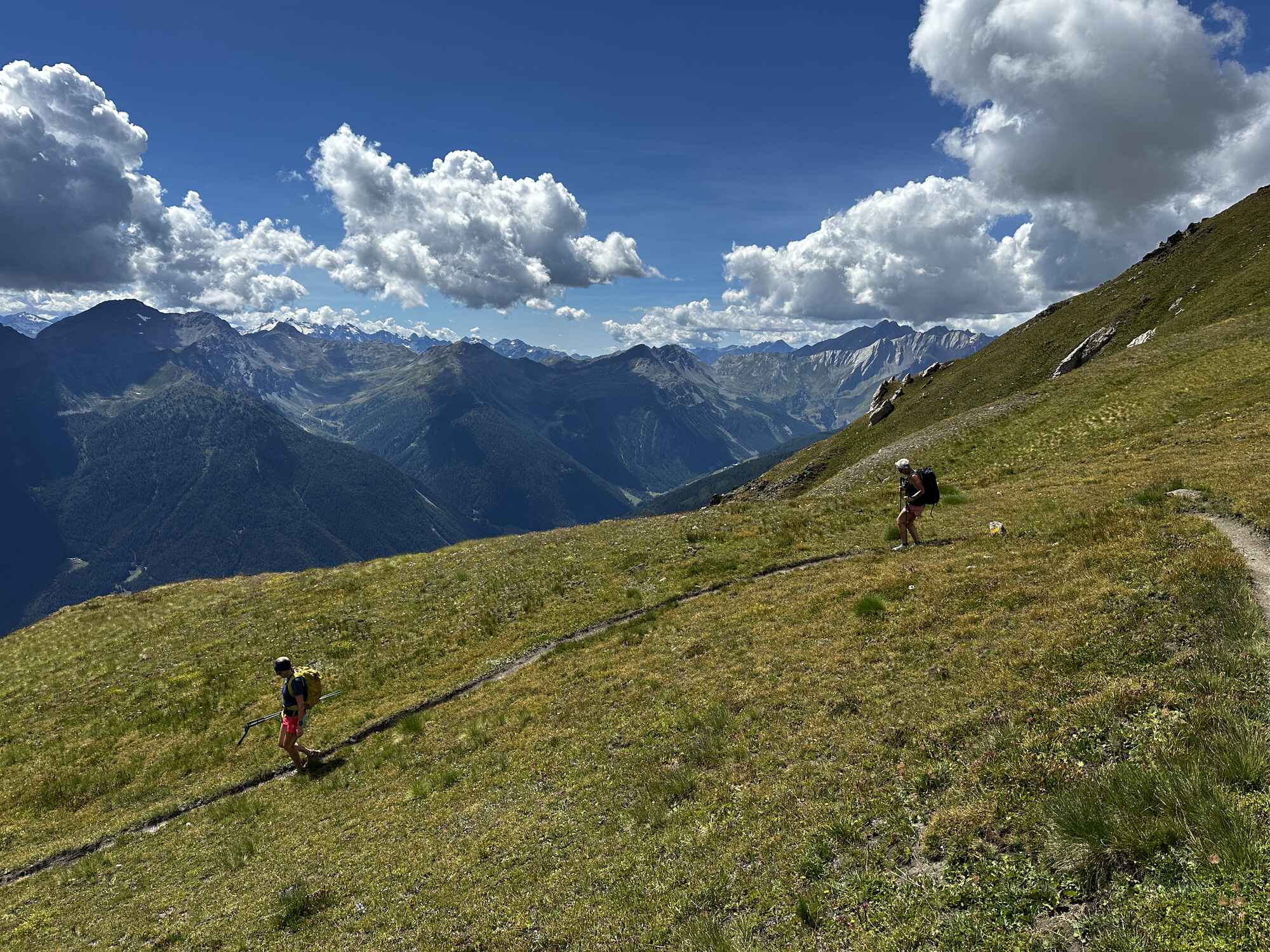 Two people decending a mountain