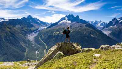 A hiker admiring the view of the Mont Blanc massif