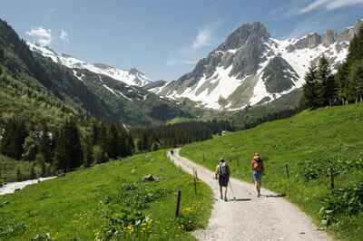 Hikers on a trail above Les Contamines